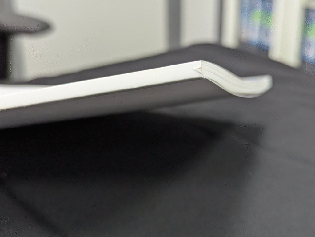Spine chipping in book trimming close-up