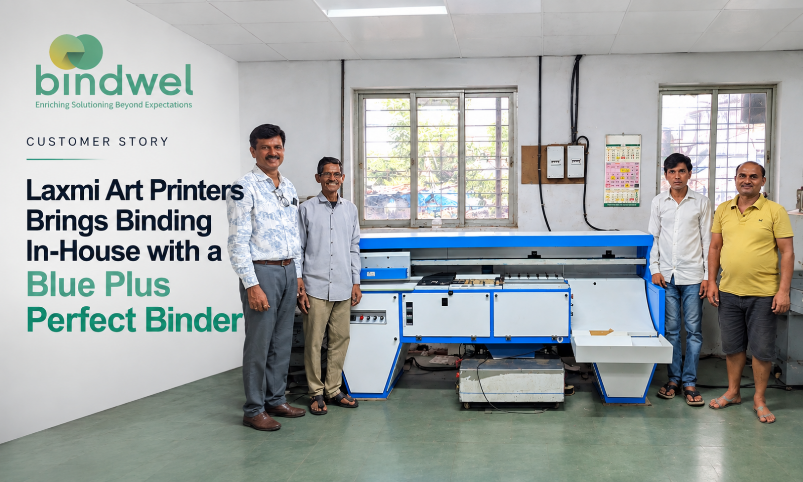 Ameya of Laxmi Art Printers beside the Blue Plus perfect binder
